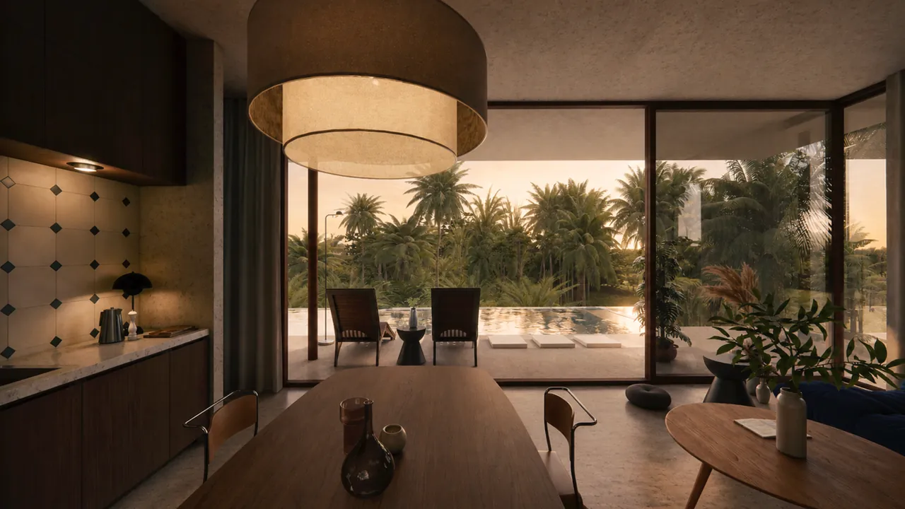 Coin repas et cuisine avec suspension design donnant sur la piscine privée et les cocotiers